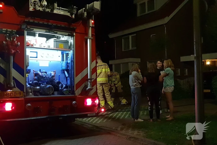 Aanbouw in brand woning vol rook