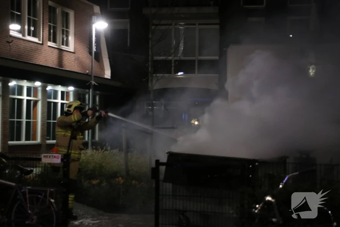 Containerbrand bij supermarkt