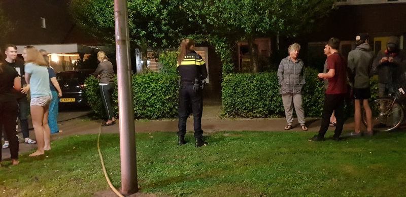 Aanbouw in brand woning vol rook