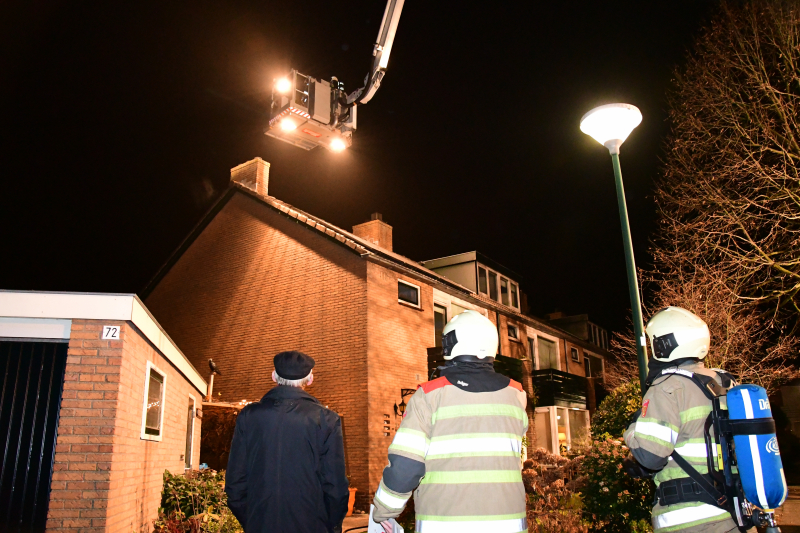 Woonkamer vol rook door schoorsteenbrand