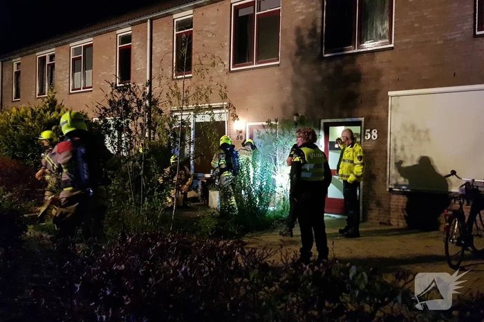 Woning vol rook door smeulende doeken