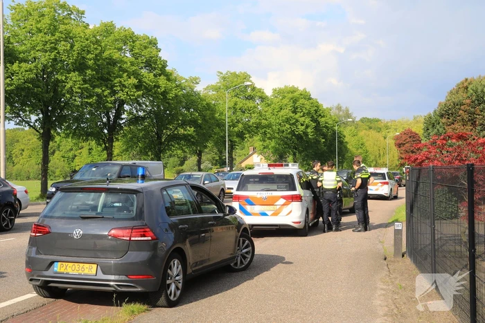 Politieauto botst op auto tijdens spoedrit