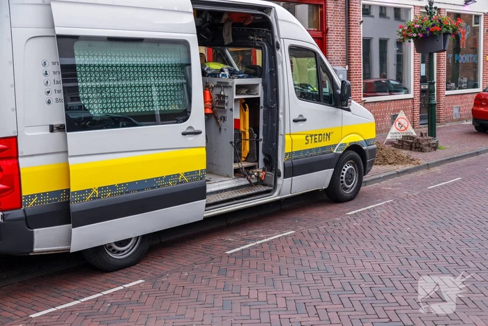Opengebroken stoep door gaslek