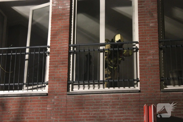 Brand door bouwlamp in appartement
