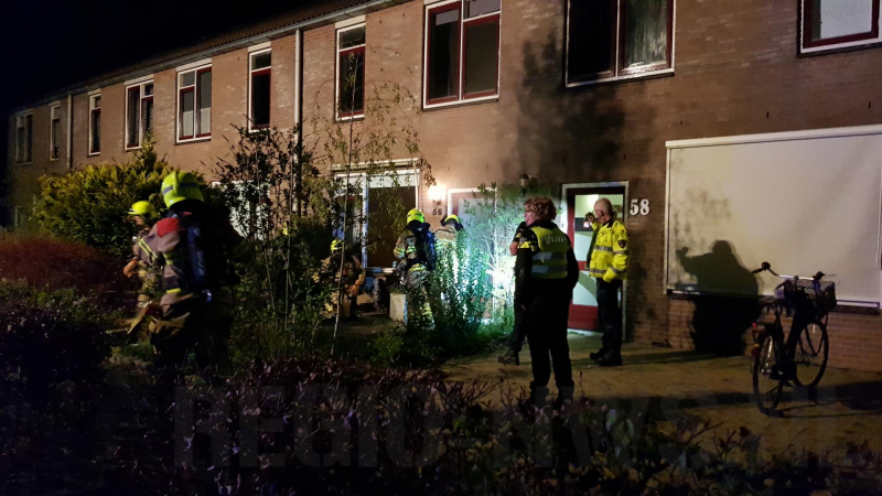 Woning vol rook door smeulende doeken