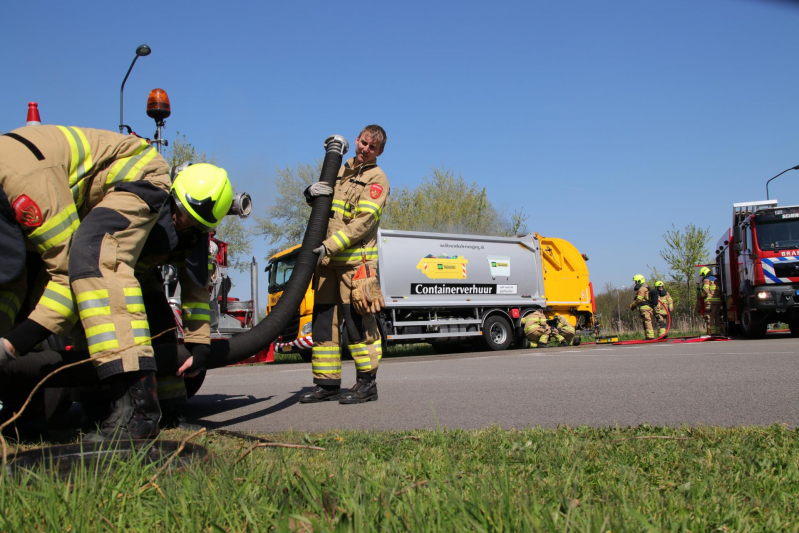 Inhoud vuilniswagen in brand
