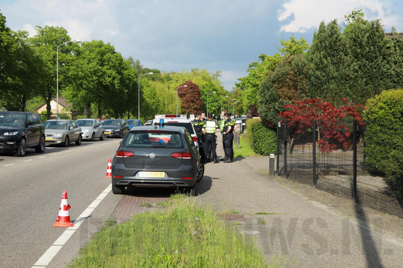Politieauto botst op auto tijdens spoedrit