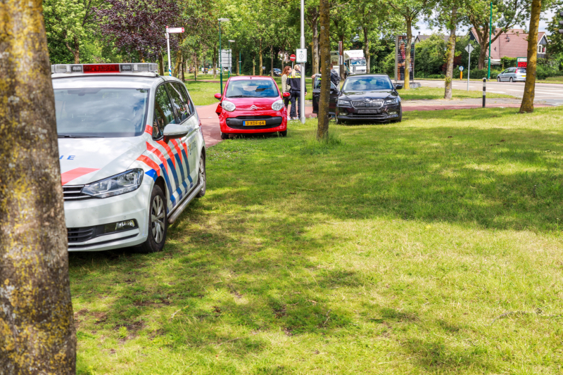 Schade na botsing op kruising