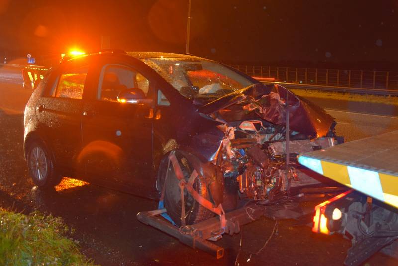 Tractor op zijn kant na aanrijding