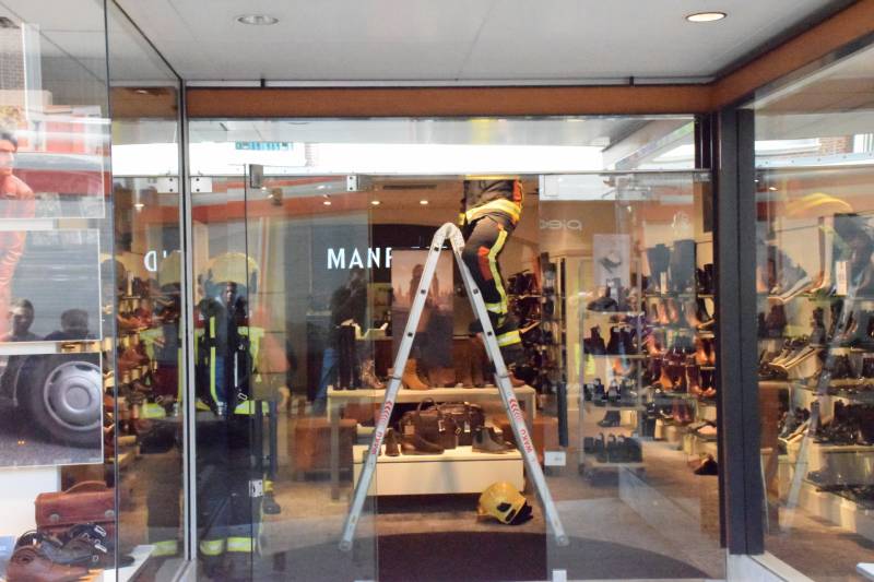 Brandlucht door smeulende transformator Manfield schoenenwinkel