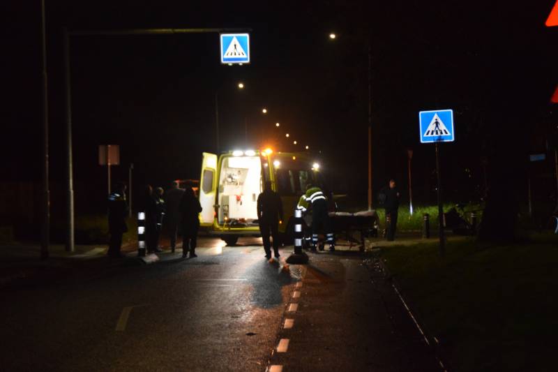 Fietser geschept door personenauto
