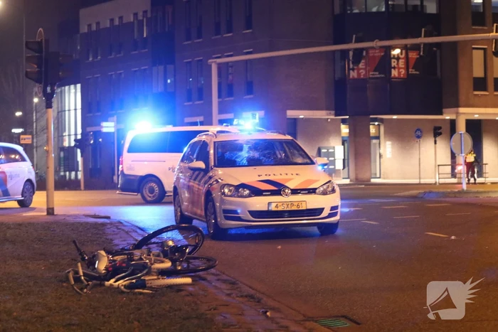 Fietsers aangereden door politieauto