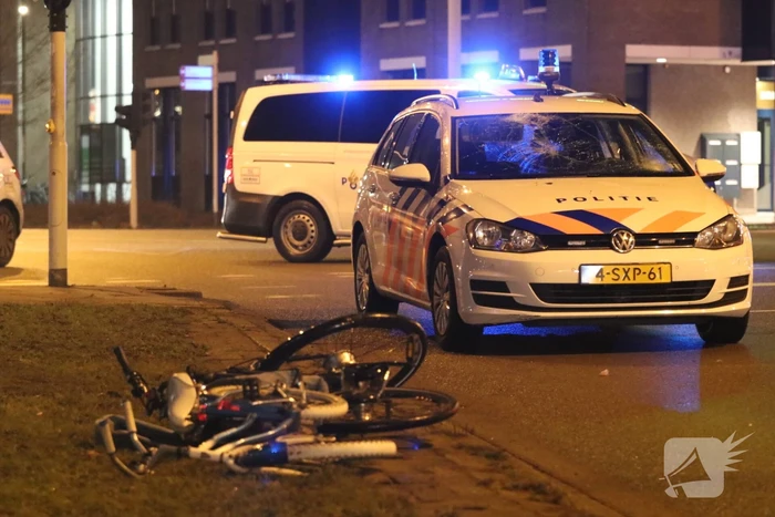 Fietsers aangereden door politieauto