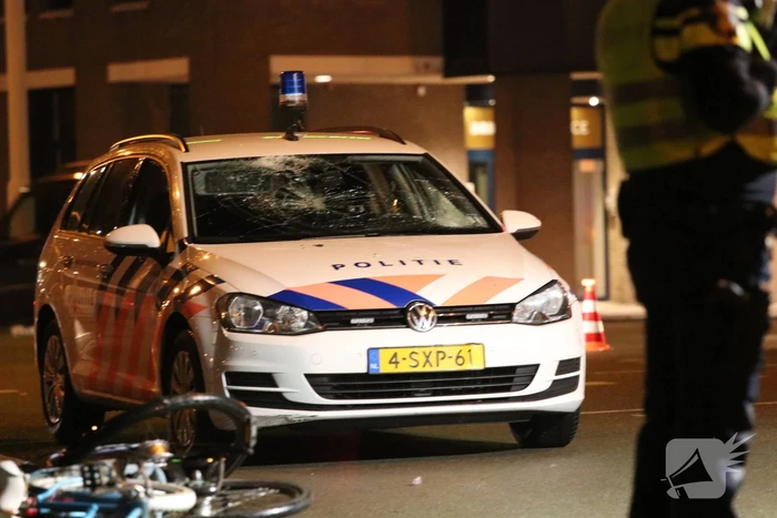 Fietsers aangereden door politieauto