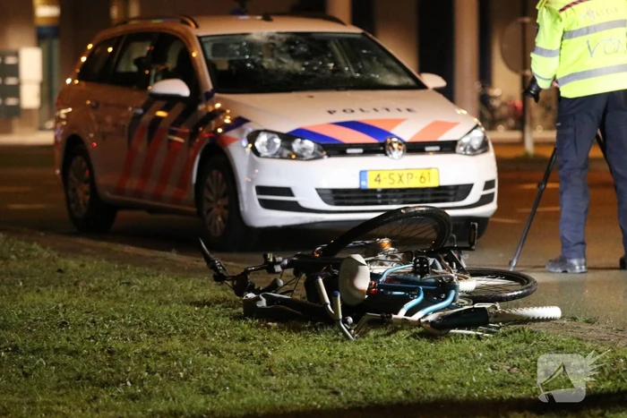 Fietsers aangereden door politieauto
