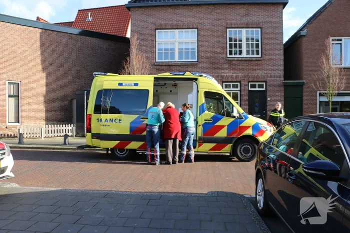 Persoon in scootmobiel ten val