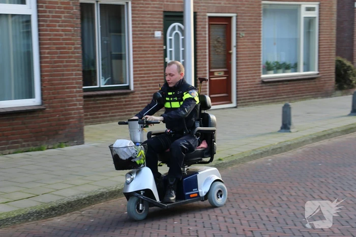 Persoon in scootmobiel ten val