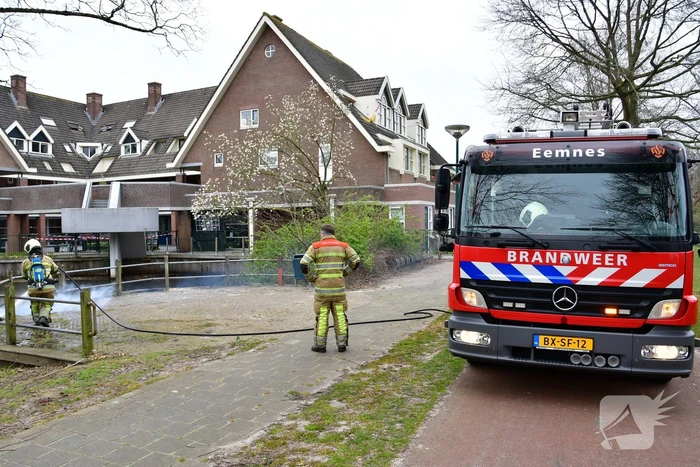 Houtwerk damwand vat vlam
