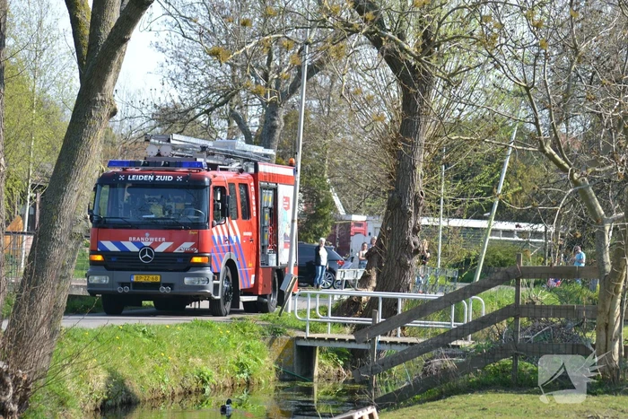 Man bekneld in leiding septictank