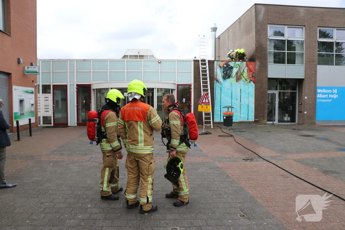 Brand in afvoerkanaal van winkel