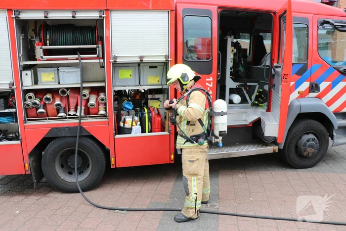Brand in afvoerkanaal van winkel