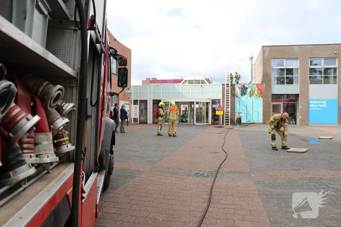 Brand in afvoerkanaal van winkel
