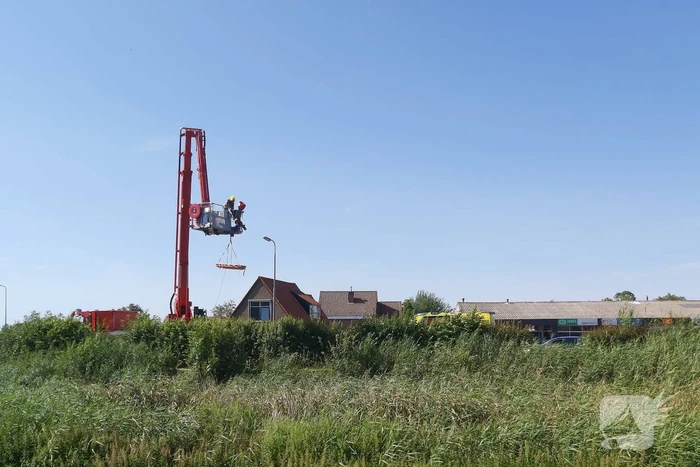 Bestuurder scootmobiel te water