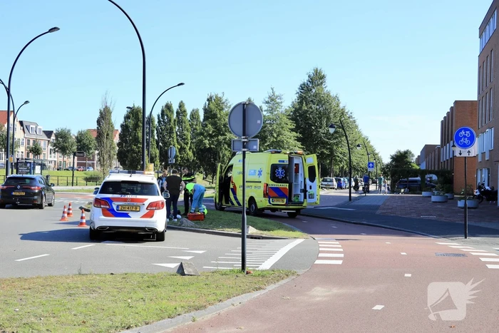 Gewonde na val met motor op rotonde