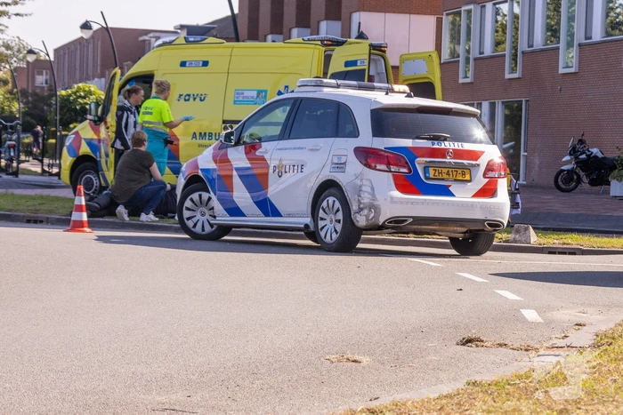 Gewonde na val met motor op rotonde