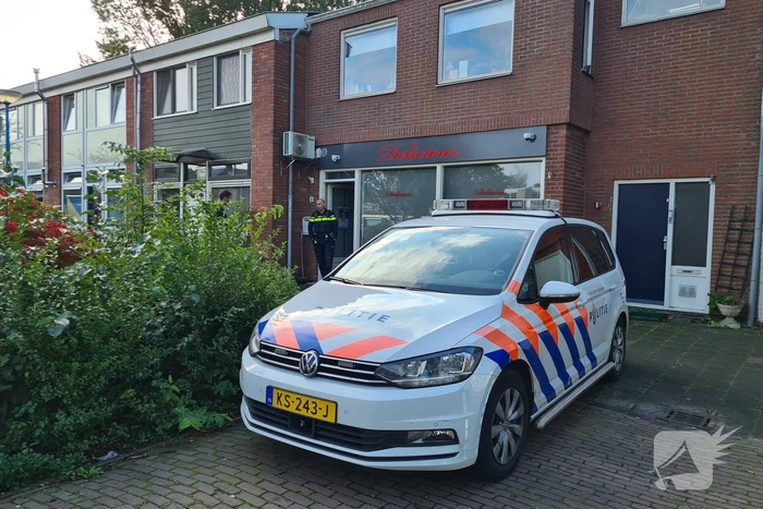 Politie en specialisten doen onderzoek bij Delicious