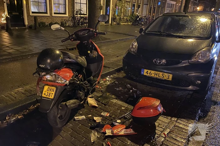 Flinke schade na botsing tussen scooter en auto