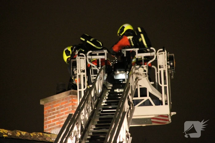 Uitslaande brand in schoorsteen