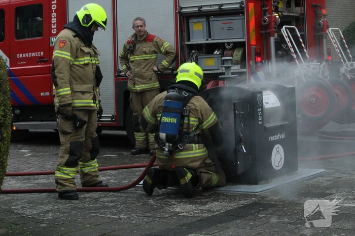 Brand in ondergrondse container snel geblust