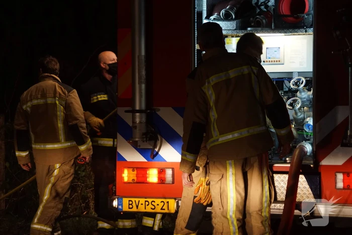 Afvalbrand in bosgebied
