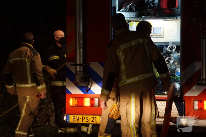 Afvalbrand in bosgebied