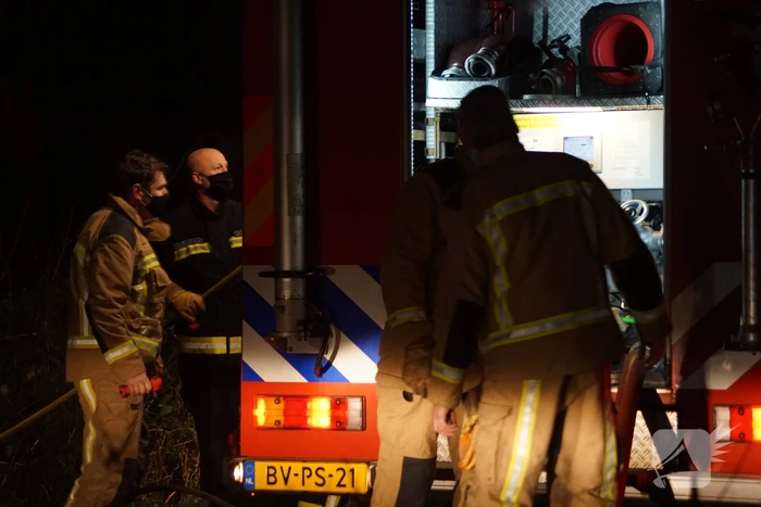 Afvalbrand in bosgebied