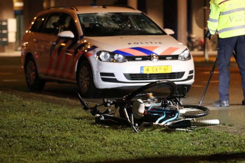 Fietsers aangereden door politieauto
