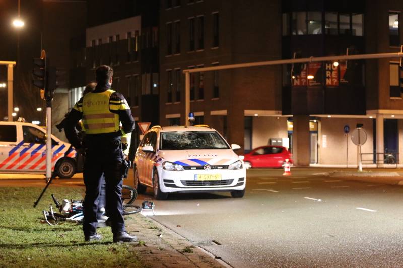 Fietsers aangereden door politieauto
