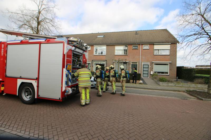 Bewoonster bij brand vast in woning