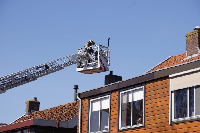 Woning vol rook bij brand in schoorsteen