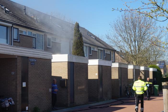 Man in boeien geslagen bij woningbrand