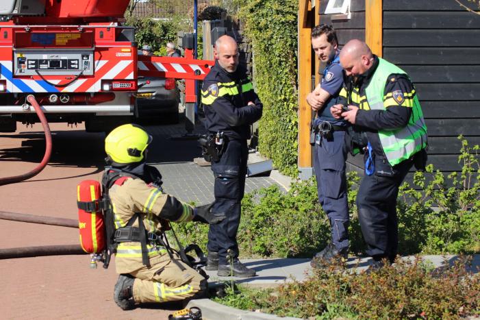 Man in boeien geslagen bij woningbrand