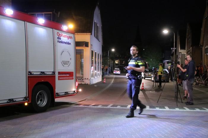 Persoon door het dak van loods gezakt