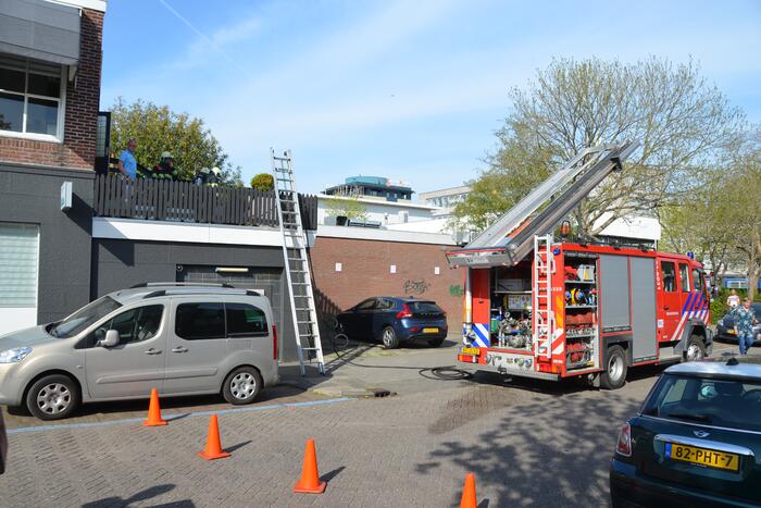 Brand op dakterras van woning