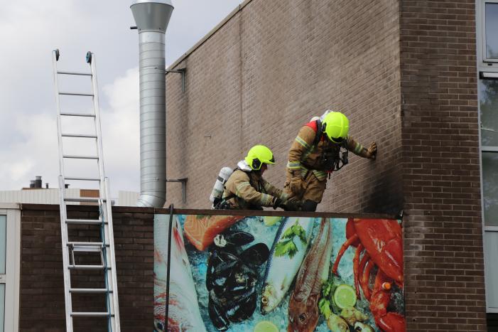 Brand in afvoerkanaal van winkel