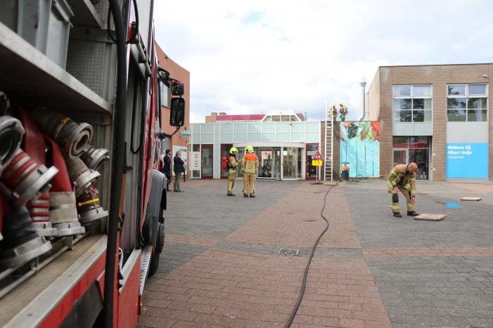 Brand in afvoerkanaal van winkel