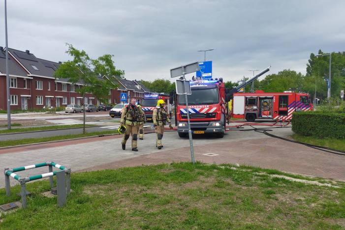 Brand in spouwmuur van woningen