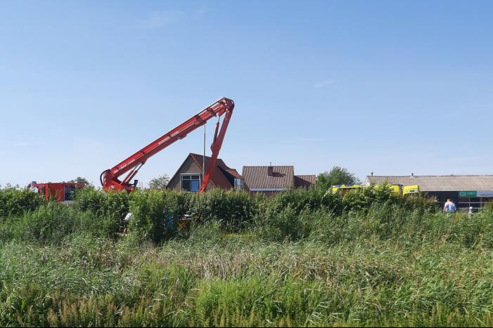 Bestuurder scootmobiel te water