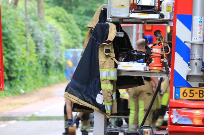 Kledingcontainer in de brand