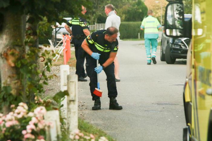 Opzittende scooter gewond na val